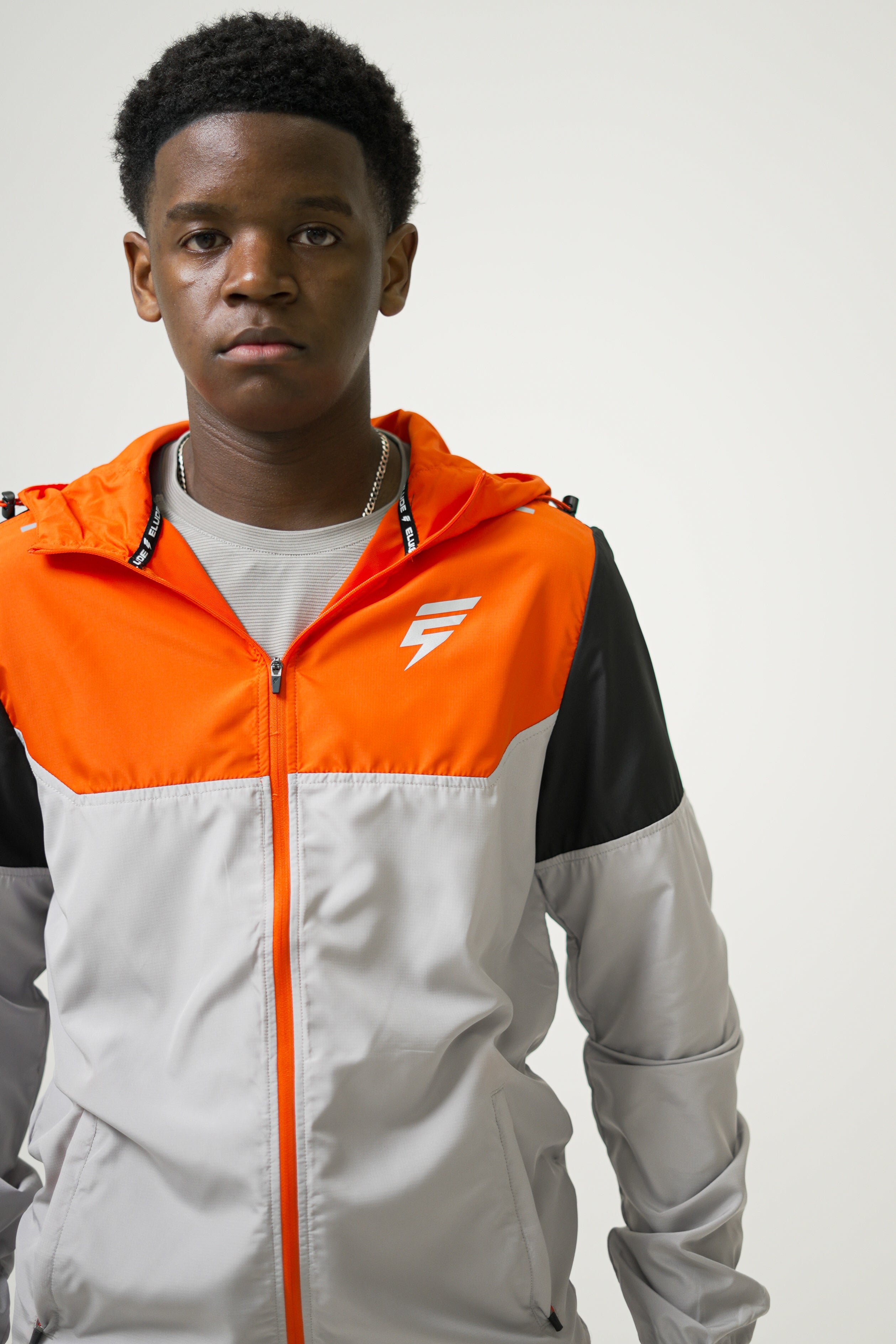 VENT WINDBREAKER SET - LIGHT GREY/BLACK/ORANGE